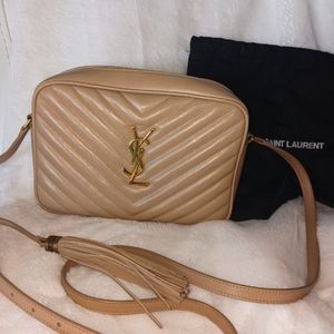 Barely used Purse by Yves St. LAURENT. Nude leather and in excellent condition.